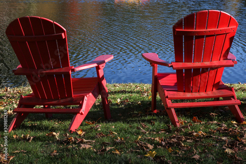Red wooden chair near water