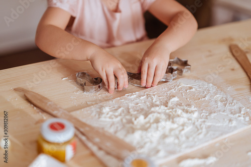 little girl cooking Christmas biscuits christmas concept