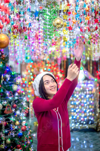 Beautiful women are lighting the stars. During the Christmas season at Tha Rae, Sakon Nakhon, Thailand