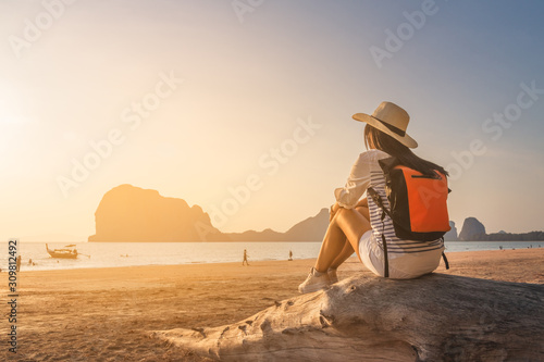 Happy traveler woman joy relaxing on summer vacation at sunset Pak Meng beach, Leisure outdoor lifestyle tourist travel Trang Thailand fun beach, Tourism beautiful destination place Asia holiday trips