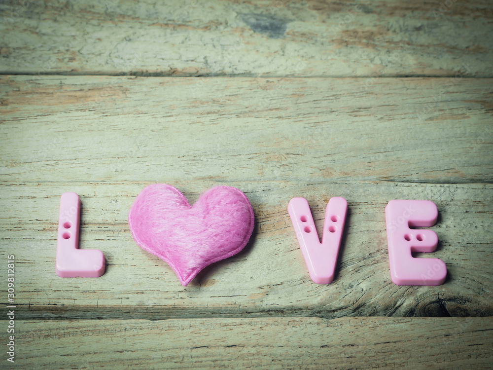 the word love on wooden background the word love on wooden background