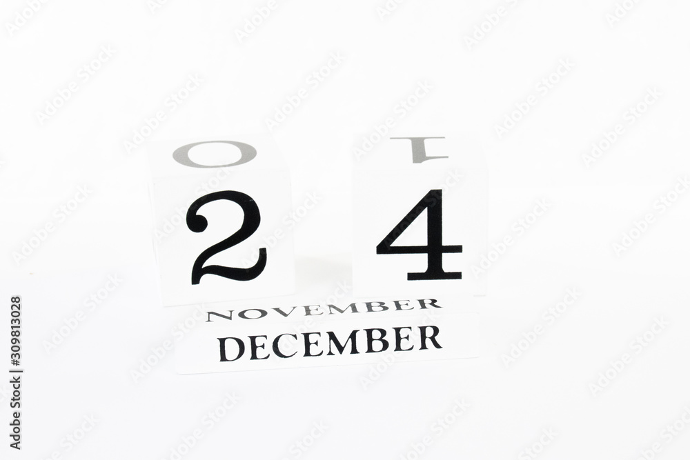 Fototapeta premium Calendar blocks against white background Christmas Eve December 24 2020