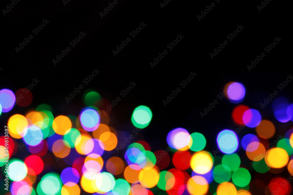 rainbow bokeh christmas lights background with place for text