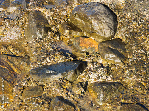 Wet stones on the coast. Tuapse, Black Sea, Caucasus photo