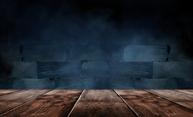 Wooden table, empty room with concrete walls. Empty studio scene.