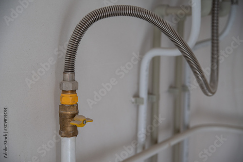 gas hose connected to the boiler in the kitchen