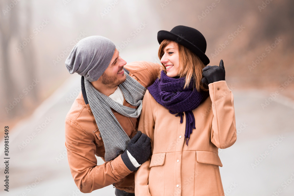 Couple enjoying outdoors in cold autumn / winter time. Couple enjoying outdoors in cold autumn / winter time.