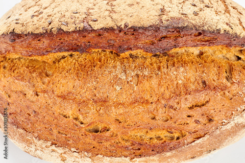 Close up view of fresh bread with seeds. Detail of crispy homemade bread. Delicious natural food.
