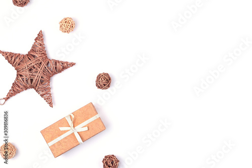 Gift present box with bow and decorations isolated on white background with copy space. Festive decoration.