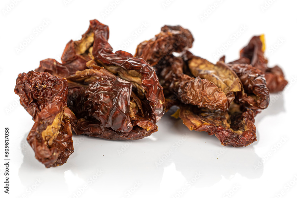 Lot of whole dried red tomato piece isolated on white background