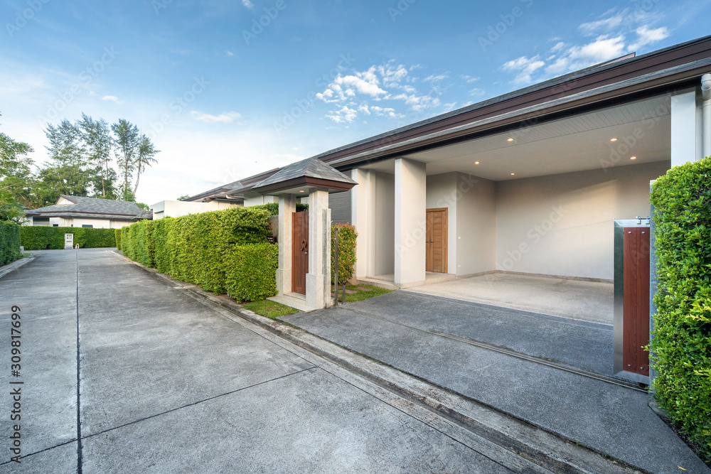 Carport of luxury pool villa and small wooden gate Carport of luxury pool villa and small wooden gate