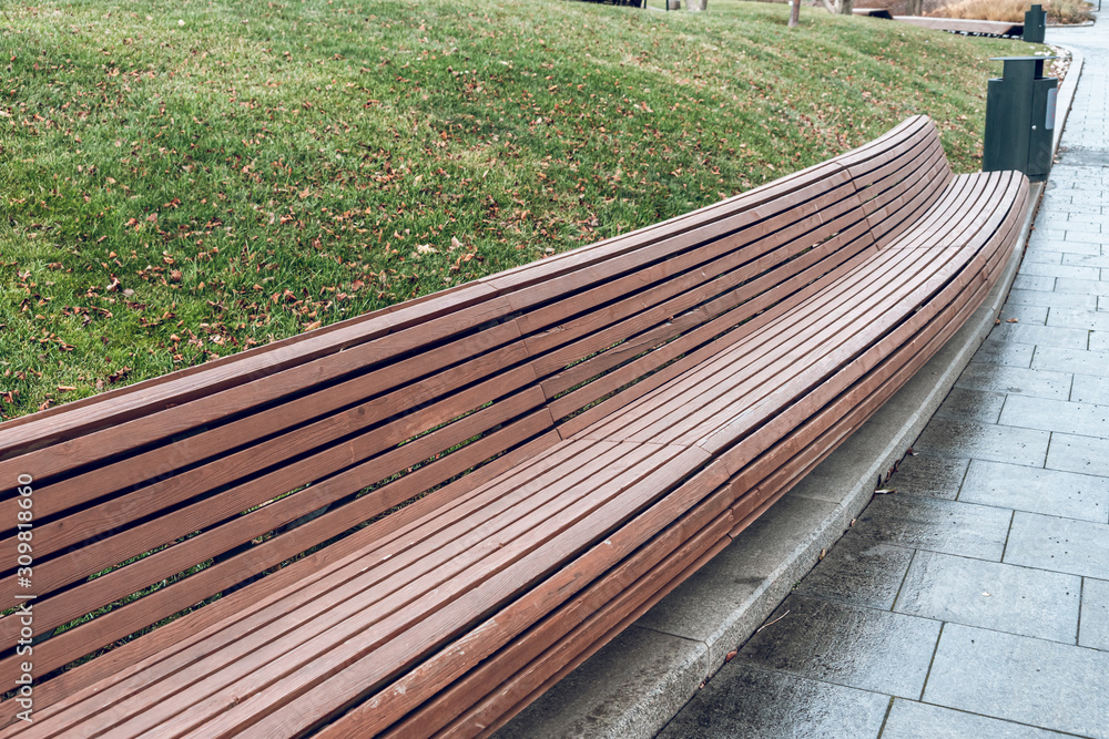 Modern long wooden bench in the park. Design of urban public space. The  landscape park. Stock Photo | Adobe Stock