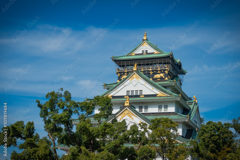 Osaka Castle with trees and blue sky, Japan 2019 Osaka Castle with trees and blue sky, Japan 2019