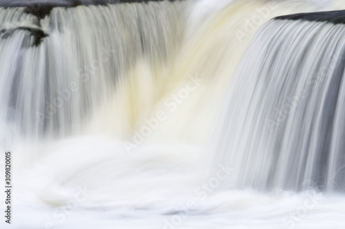 Landscape captured with blurred motion of a cascade on the Rabbit River  Michigan  USA