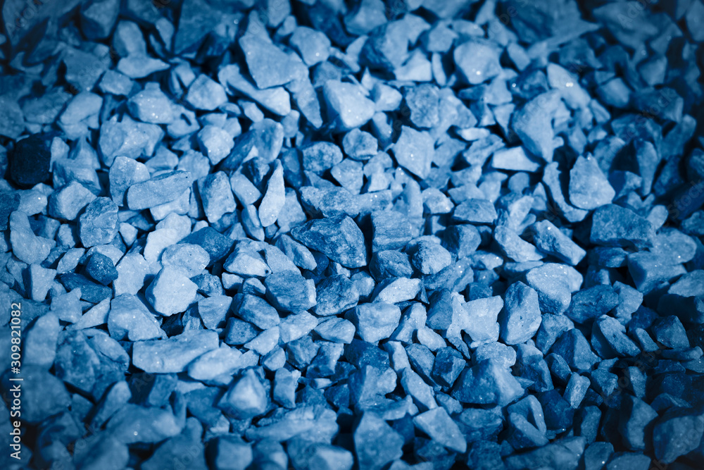 Decorative flowerbed stones background toned in classic blue color of the year 2020 Decorative flowerbed stones background toned in classic blue color of the year 2020