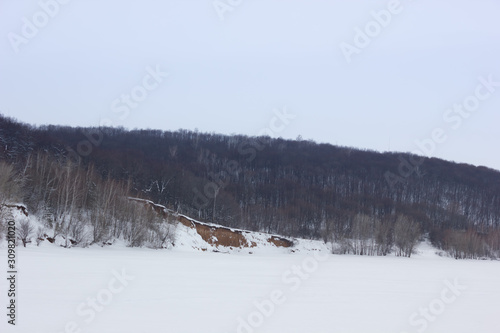 Winter snowy landscape with hills and trees