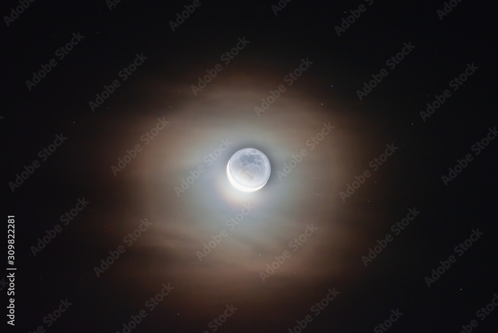 The moon among the stars and clouds The moon among the stars and clouds