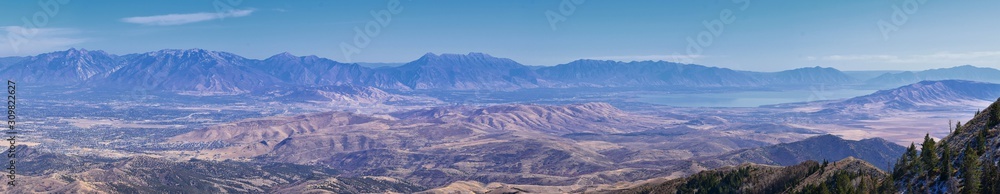 Wasatch Front Rocky Mountain landscapes from Oquirrh range looking at Utah Lake during fall. Panorama views near Provo, Timpanogos, Lone and Twin Peaks. Salt Lake City. United States.