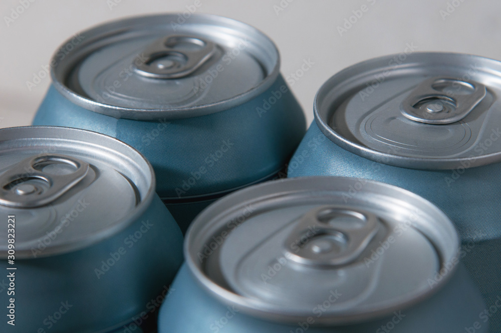 beer packaging. silver blue beer cans. aluminum cans background beer packaging. silver blue beer cans. aluminum cans background