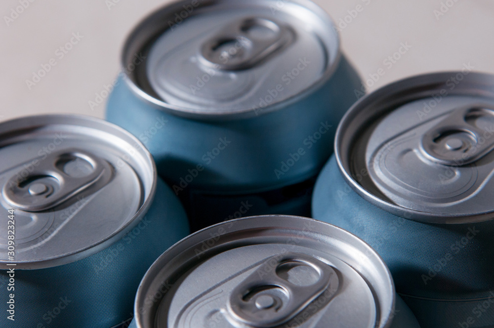 beer packaging. silver blue beer cans. aluminum cans background beer packaging. silver blue beer cans. aluminum cans background