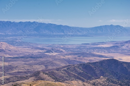 Wasatch Front Rocky Mountain landscapes from Oquirrh range looking at Utah Lake during fall. Panorama views near Provo  Timpanogos  Lone and Twin Peaks. Salt Lake City. United States.