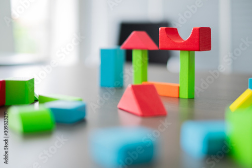 A lot of block puzzle geometry colorful on the table photo