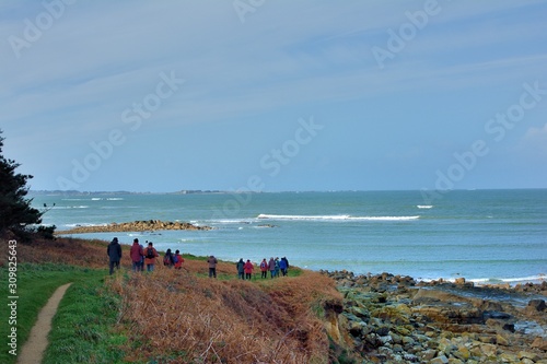 Group of hikers on a path in Brittany. France photo