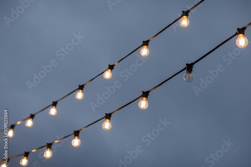 light bulbs on sky background. all work except one