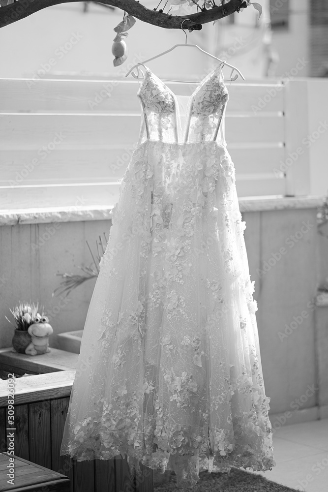 Wedding dresses hanging on a hanger. Wedding dresses hanging on a hanger.