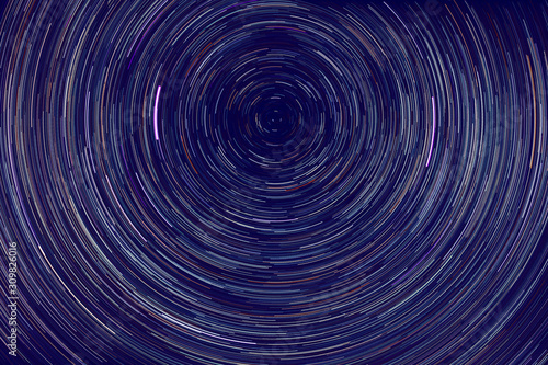 star trails -  light streaks of stars around Polaris in the night sky due to Earth s rotation