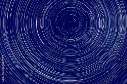 star trails - light streaks of stars around Polaris in the night sky due to Earth's rotation