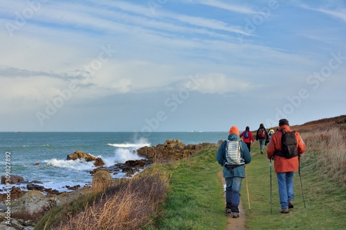 Group of hikers on a path in Brittany. France