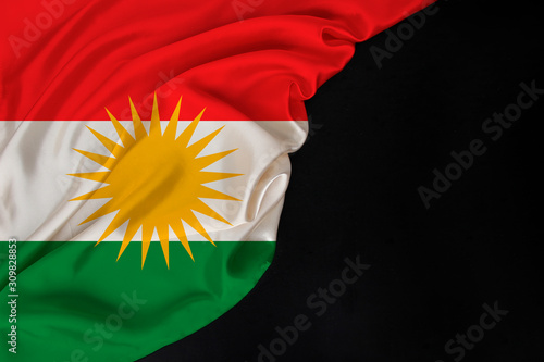 color national flag of modern state of Kurdistan, beautiful silk, black blank form, concept of tourism, economy, politics, emigration, independence day, copy space, template, horizontal