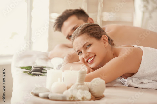 Young couple relaxing in spa salon