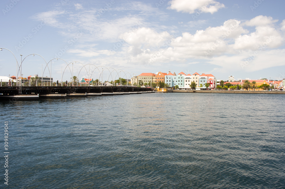 Colorful historical buildings and the Queen Emma floating bridge of Willemstad, Curacao