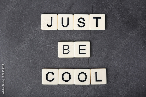 Inspirational sentence formed with game tiles Just be Cool © nastyakamysheva