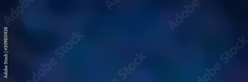 blurred iridescent horizontal background with very dark blue and midnight blue colors and space for text or image