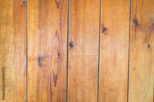 Old brown wooden background with vertical boards.