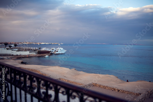 The view of Red sea with ship and cloudly sky before rain in Hurhgada