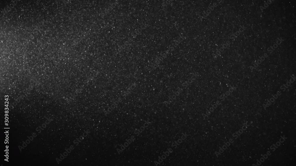 Natural Organic Dust Particles Floating On Black Background. Glittering Sparkling Particles Randomly Spin In The Air With Bokeh. Dynamic Particles With Fast And Slow Motion. Shimmering Dust In Space. Natural Organic Dust Particles Floating On Black Background. Glittering Sparkling Particles Randomly Spin In The Air With Bokeh. Dynamic Particles With Fast And Slow Motion. Shimmering Dust In Space.