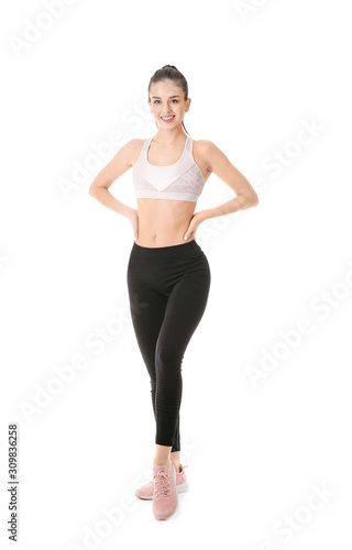 Sporty young woman on white background © Pixel-Shot