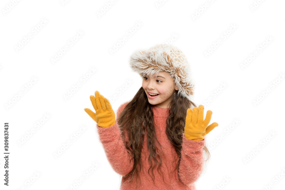 warm my hands. her favorite knitted sweater. active healthy childhood. winter warmness. kid fashion. cheerful little kid isolated on white. ready for winter cold. small girl earflap hat and gloves warm my hands. her favorite knitted sweater. active healthy childhood. winter warmness. kid fashion. cheerful little kid isolated on white. ready for winter cold. small girl earflap hat and gloves