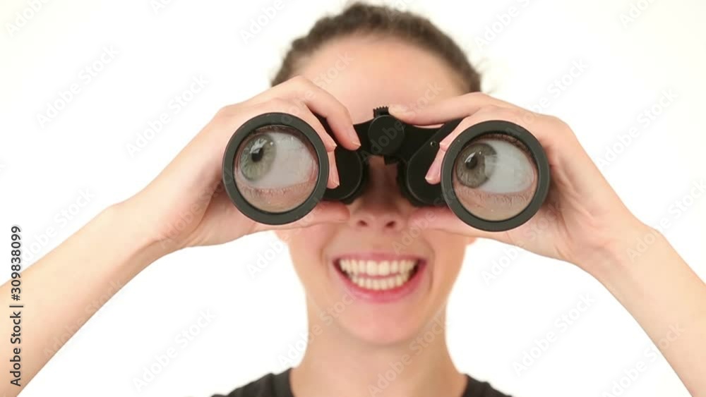 Young woman searching with binoculars, rolling eyes around. Young woman searching with binoculars, rolling eyes around.