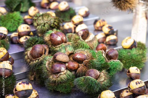 Shelled chestnuts close-up. Shells are green in color and prickly.