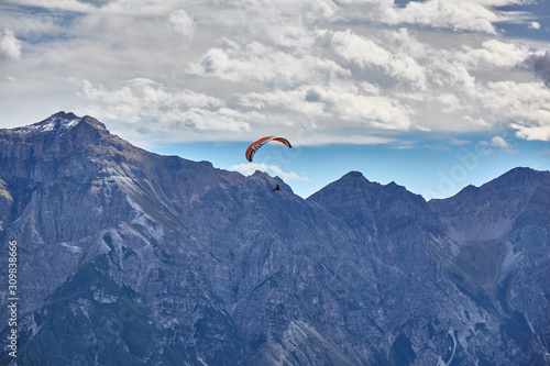 Paragliding in the mountains, in the Stubai Valley, Tyrol, Austria.