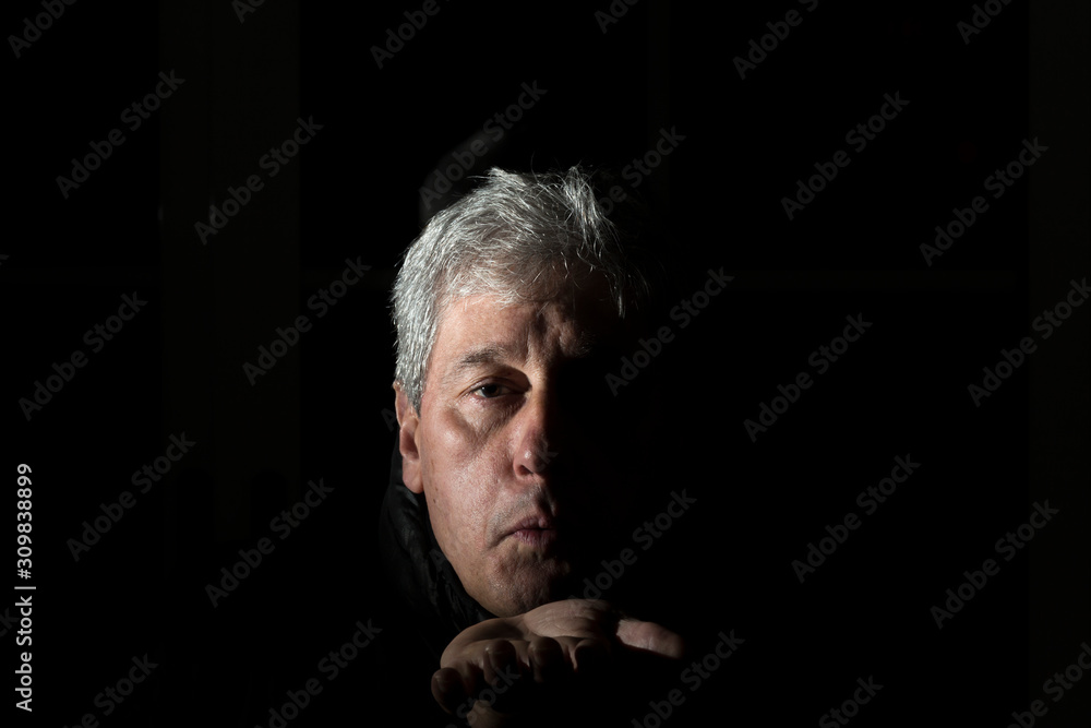 chiaroscuro portrait of a white-haired man chiaroscuro portrait of a white-haired man