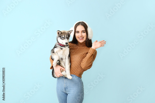Cute woman with funny husky...