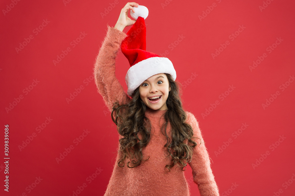 going crazy kid. feeling happy about new year. time for christmas holiday. small girl in santa hat. happy child red background. winter kid fashion. favorite winter holiday. having fun. little santa going crazy kid. feeling happy about new year. time for christmas holiday. small girl in santa hat. happy child red background. winter kid fashion. favorite winter holiday. having fun. little santa