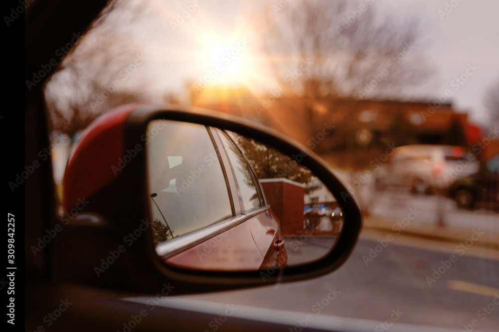 A view of a sunbeam from a side view mirror in a car