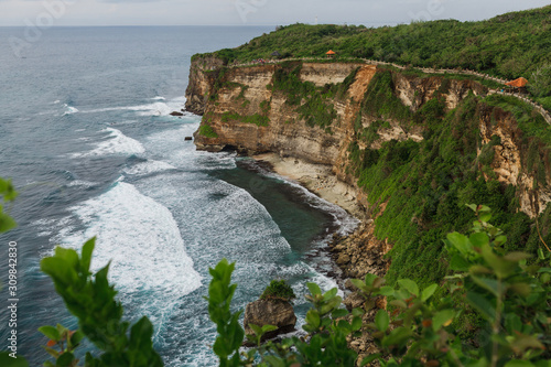 The rocky coast of the island of Bali. Wave, the ocean, evening, clouds.